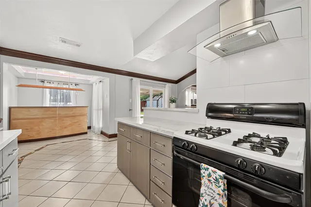 a kitchen with stainless steel appliances granite countertop a sink and cabinets