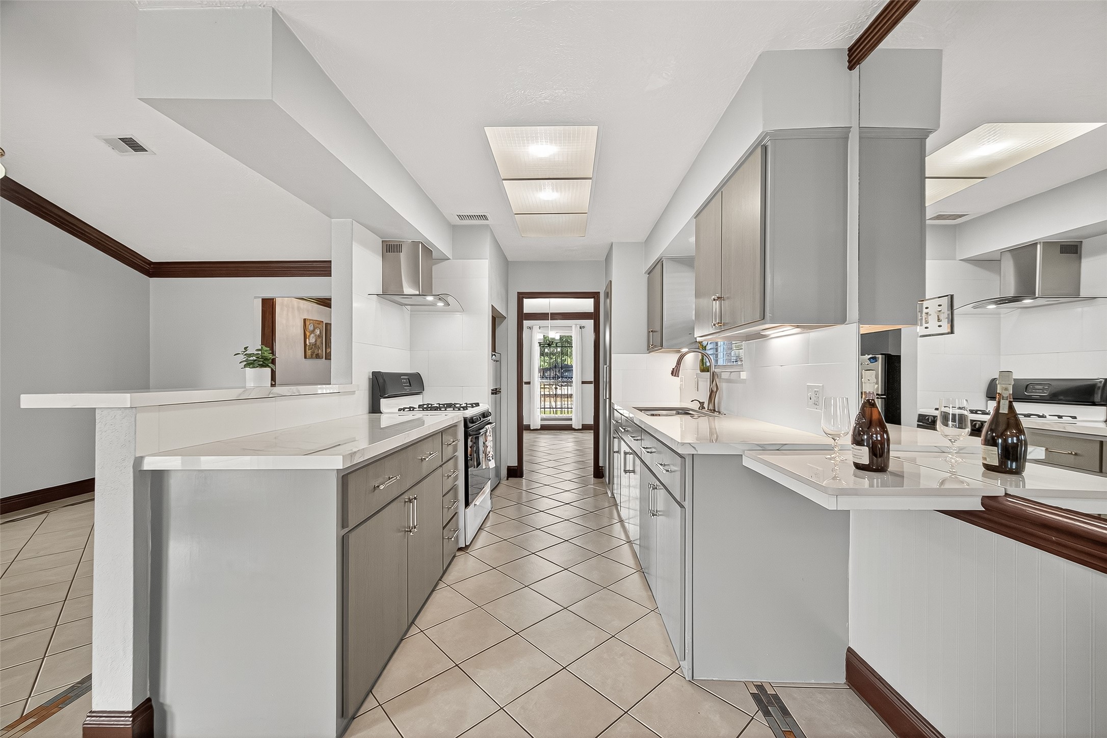 14007 Buffalo Speedway Houston, TX 77045 - Photo 22 of 46 a kitchen with stainless steel appliances a sink stove and cabinets