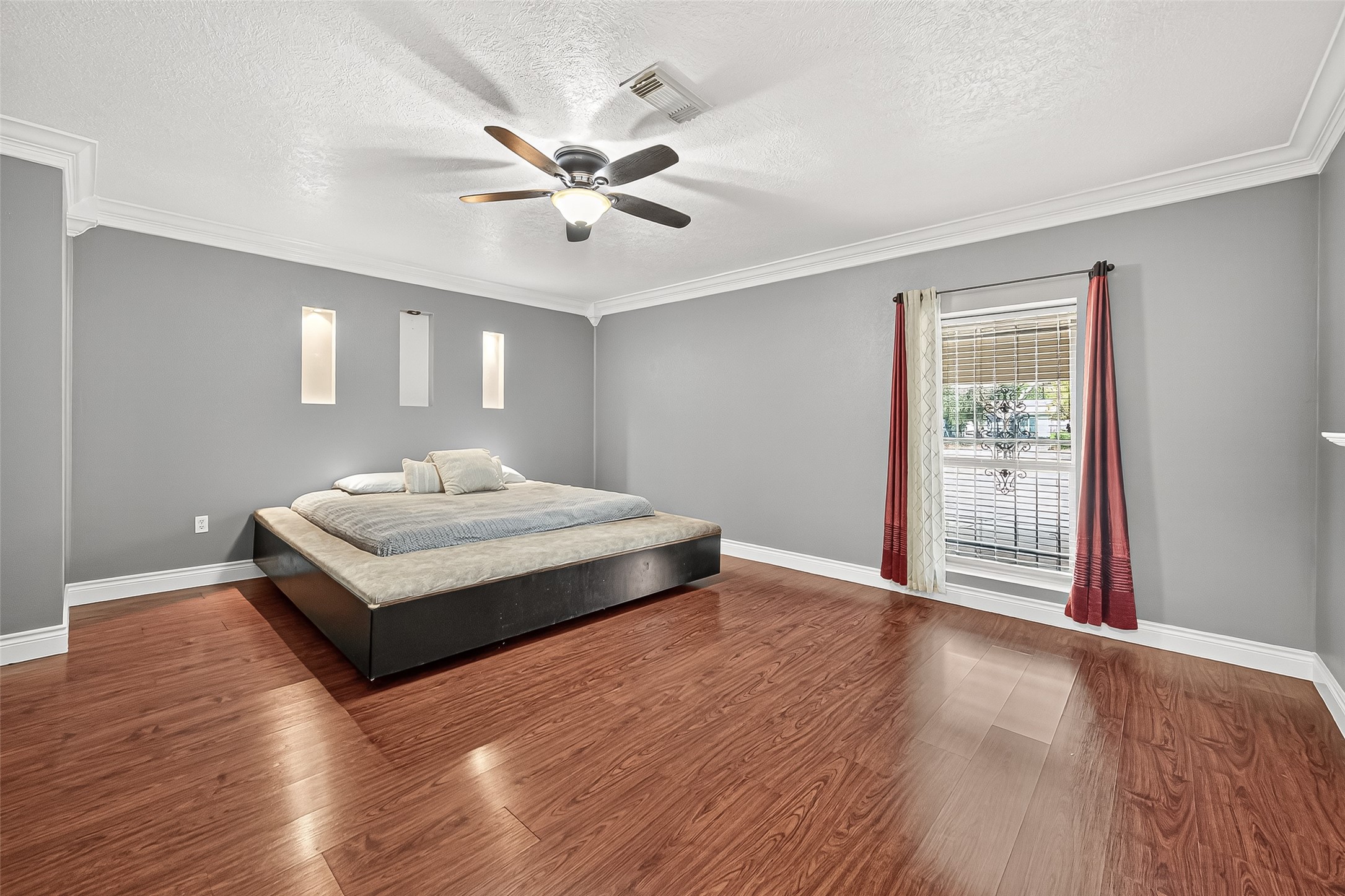 14007 Buffalo Speedway Houston, TX 77045 - Photo 34 of 46 a bedroom with a bed and a chandelier