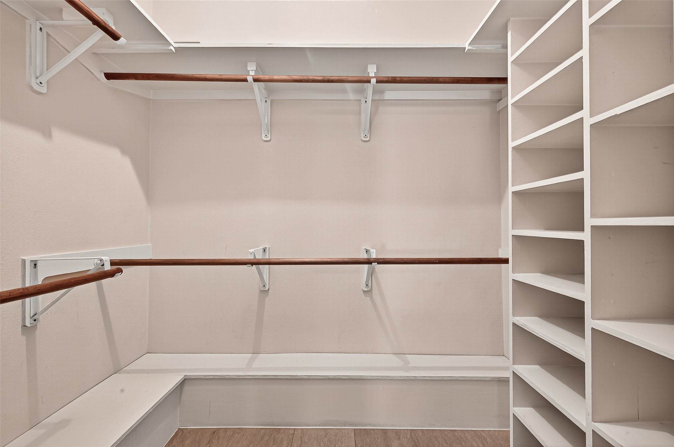 14007 Buffalo Speedway Houston, TX 77045 - Photo 37 of 46 a view of walk in closet with empty racks