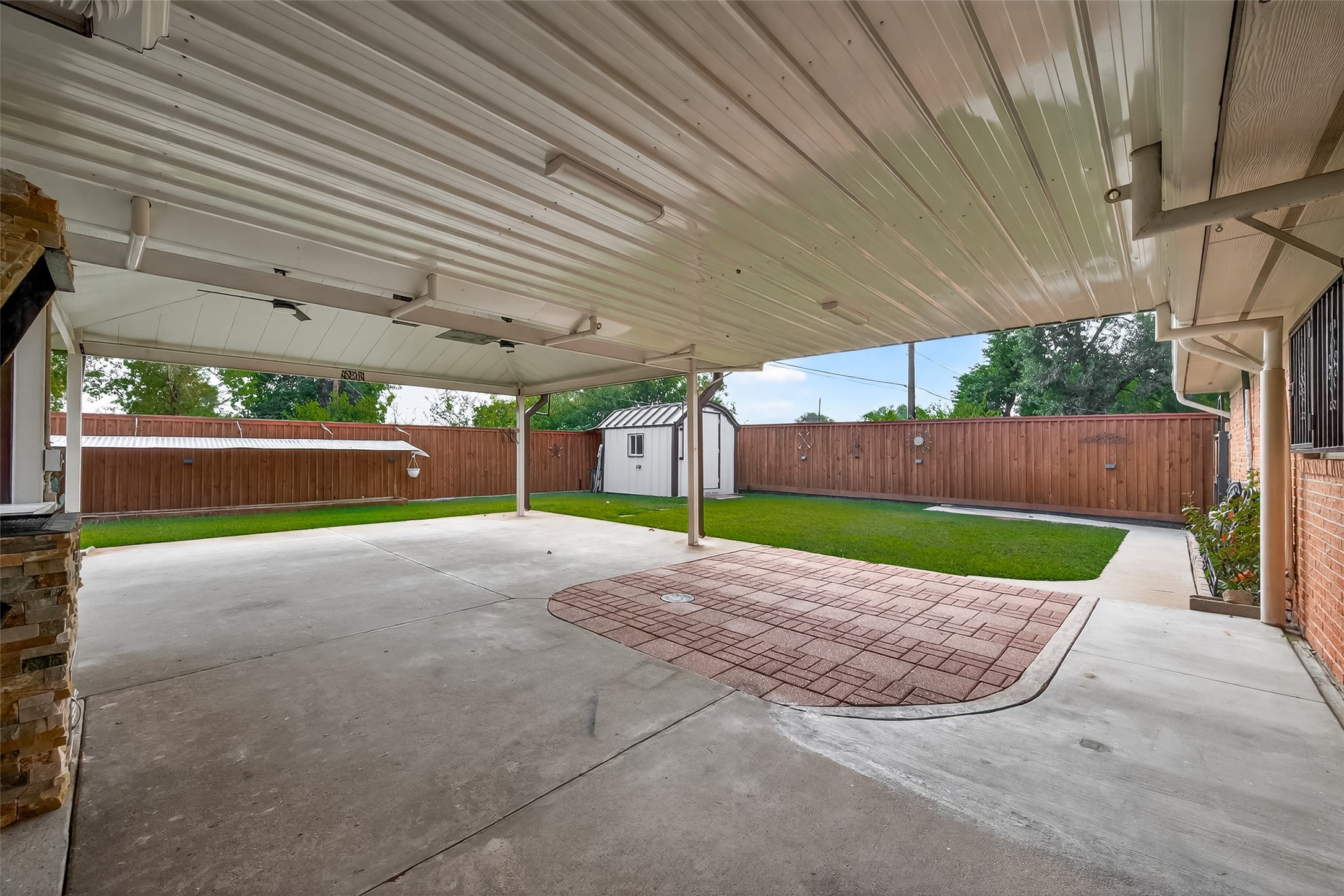 14007 Buffalo Speedway Houston, TX 77045 - Photo 38 of 46 a view of a backyard with brick wall and fence