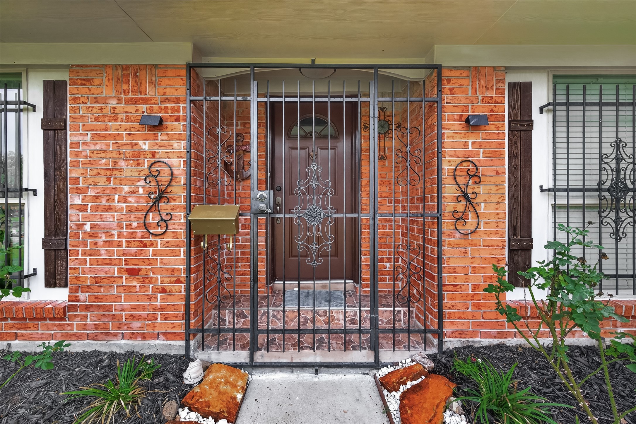 14007 Buffalo Speedway Houston, TX 77045 - Photo 5 of 46 a view of a door with a potted plant and a door