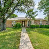 a front view of a house with yard