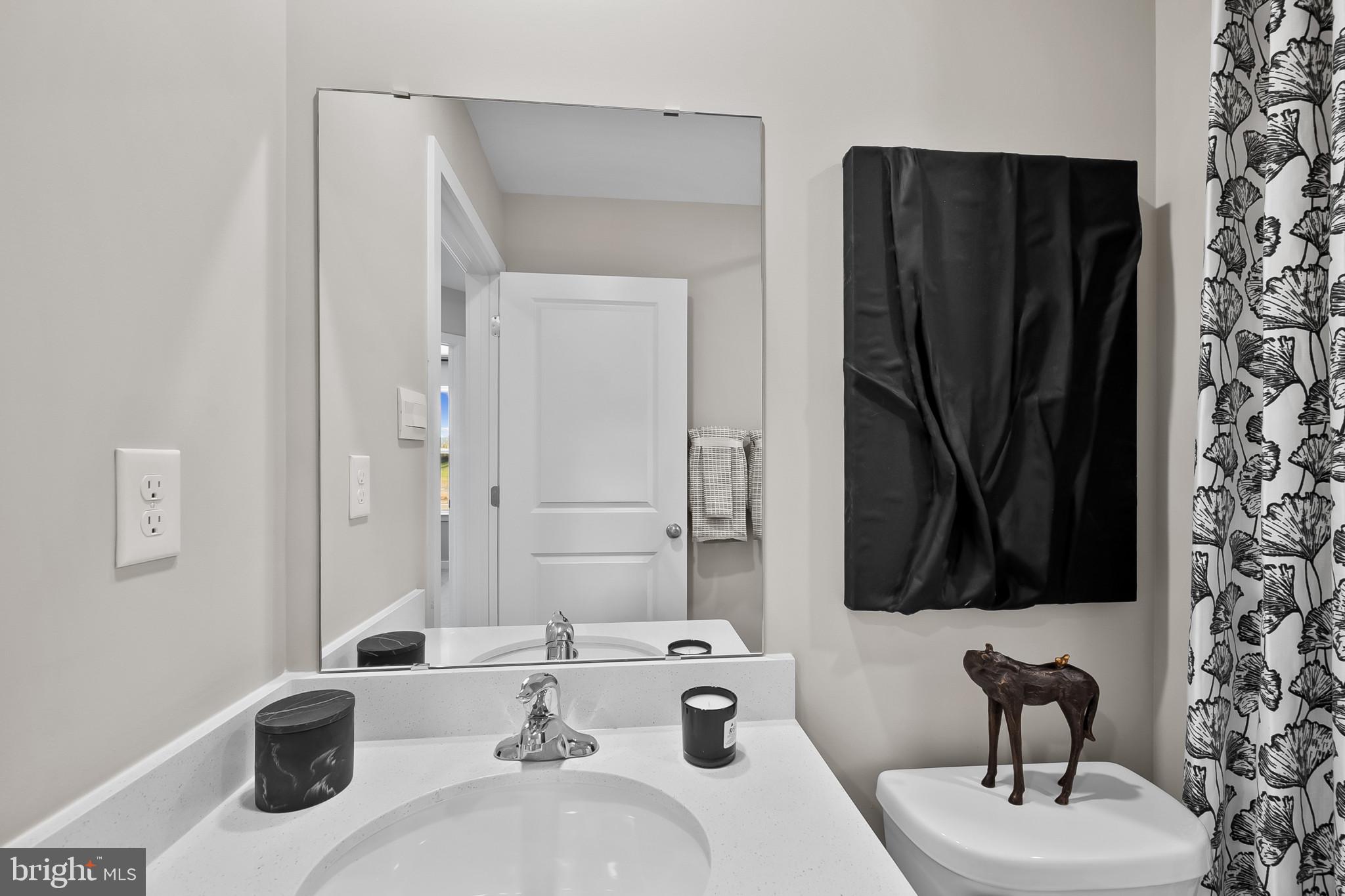48 Aloma Street Ranson, WV 25438 - Photo 22 of 46 a bathroom with a sink and a mirror