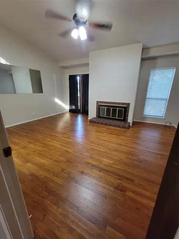 a view of a livingroom with wooden floor