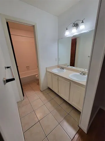 a white toilet sitting next to a bath tub and a shower