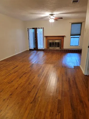 a view of a livingroom with wooden floor