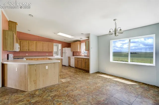 a spacious bathroom with a granite countertop sink a mirror and a vanity