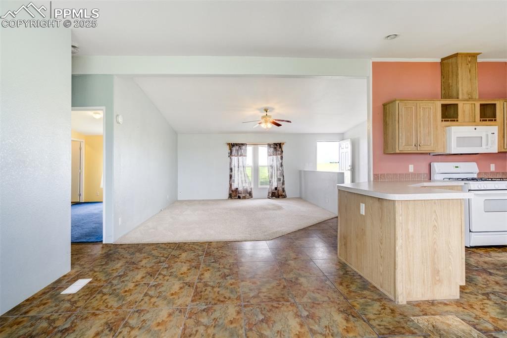 1435 Equestrian Point Yoder, CO 80864 - Photo 14 of 49 a spacious bathroom with a granite countertop sink a mirror and a vanity