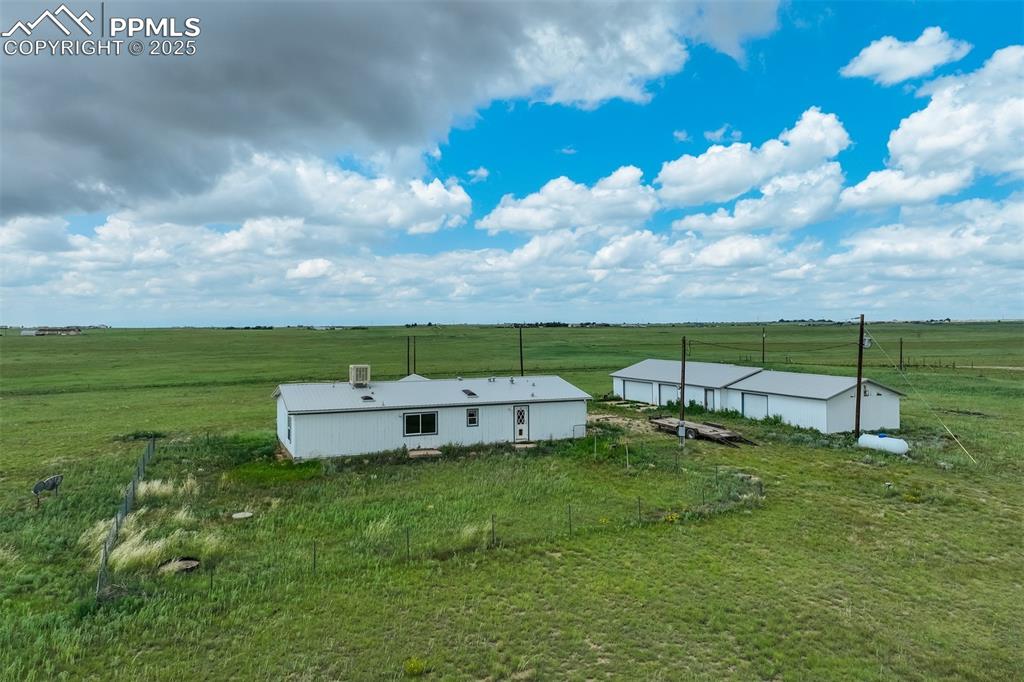 1435 Equestrian Point Yoder, CO 80864 - Photo 2 of 49 a view of a house with a yard