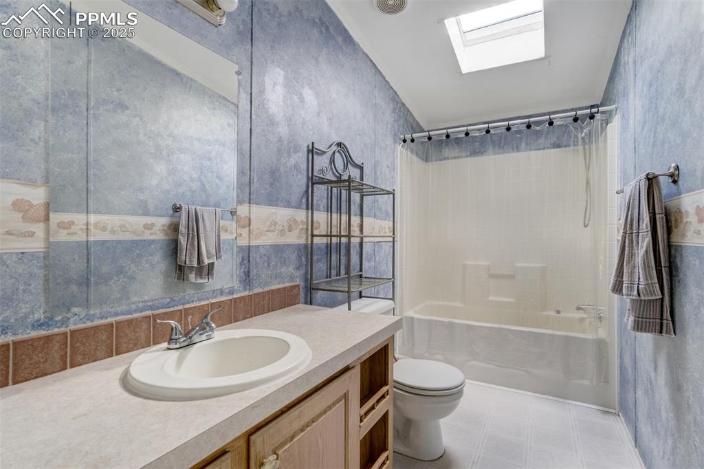 1435 Equestrian Point Yoder, CO 80864 - Photo 29 of 49 a bathroom with a sink a toilet and shower