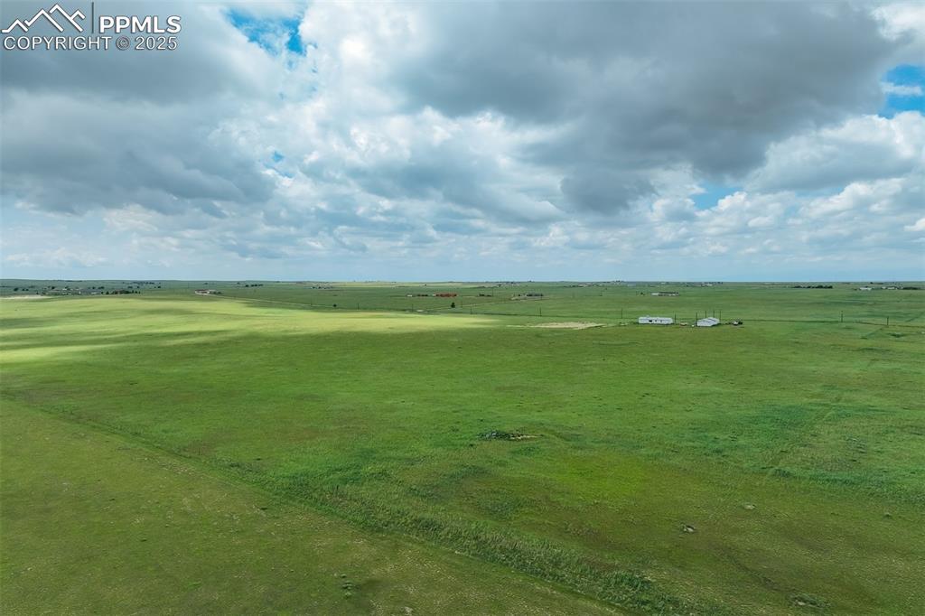 1435 Equestrian Point Yoder, CO 80864 - Photo 48 of 49 a view of a golf course with a big yard