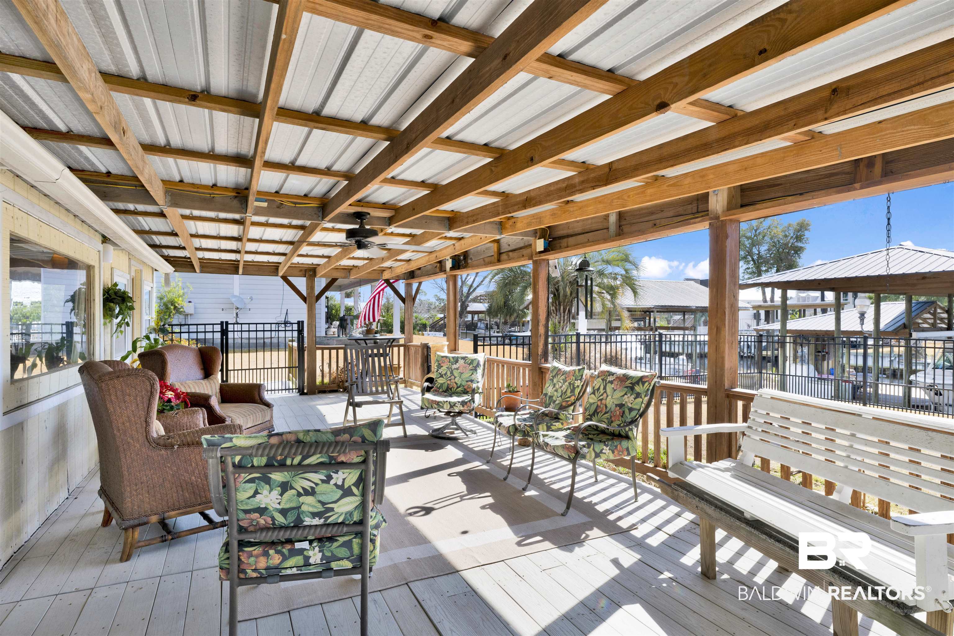 26222 Marina Road Orange Beach, AL 36561 - Photo 35 of 38 Deck with ceiling fan and an outdoor hangout area