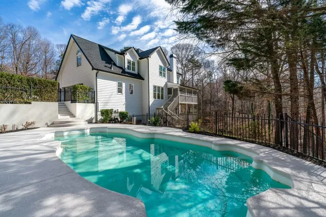 a kitchen with granite countertop cabinets stainless steel appliances and wooden floor
