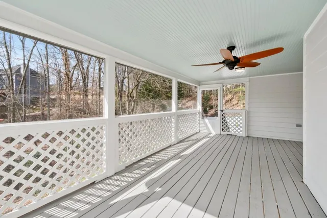 a bath tub sitting in a bathroom next to a window
