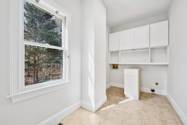 a bathroom with a granite countertop sink mirror and shower