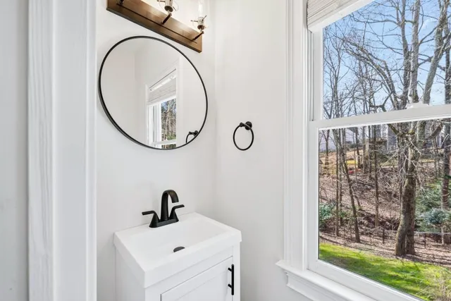 an empty walk in closet with wooden floor