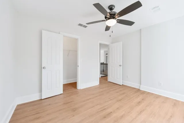 a bathroom with a toilet a sink a mirror a bathtub and shower