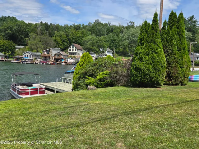 a view of a table and chairs in the garden