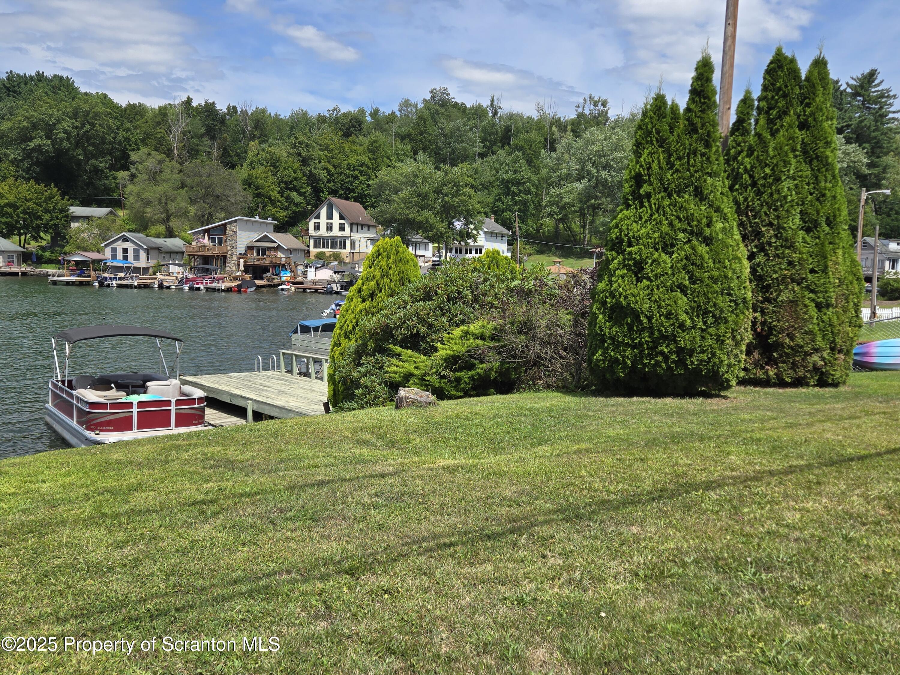 1228 Lake Road Factoryville, PA 18419 - Photo 1 of 31 a view of a table and chairs in the garden