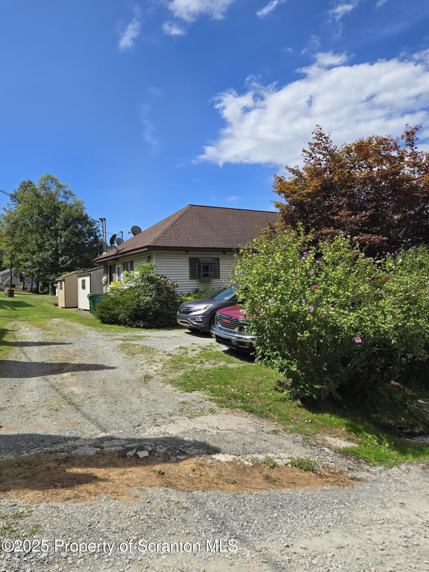 1228 Lake Road Factoryville, PA 18419 - Photo 12 of 31 a view of a street with a lots of plants and trees