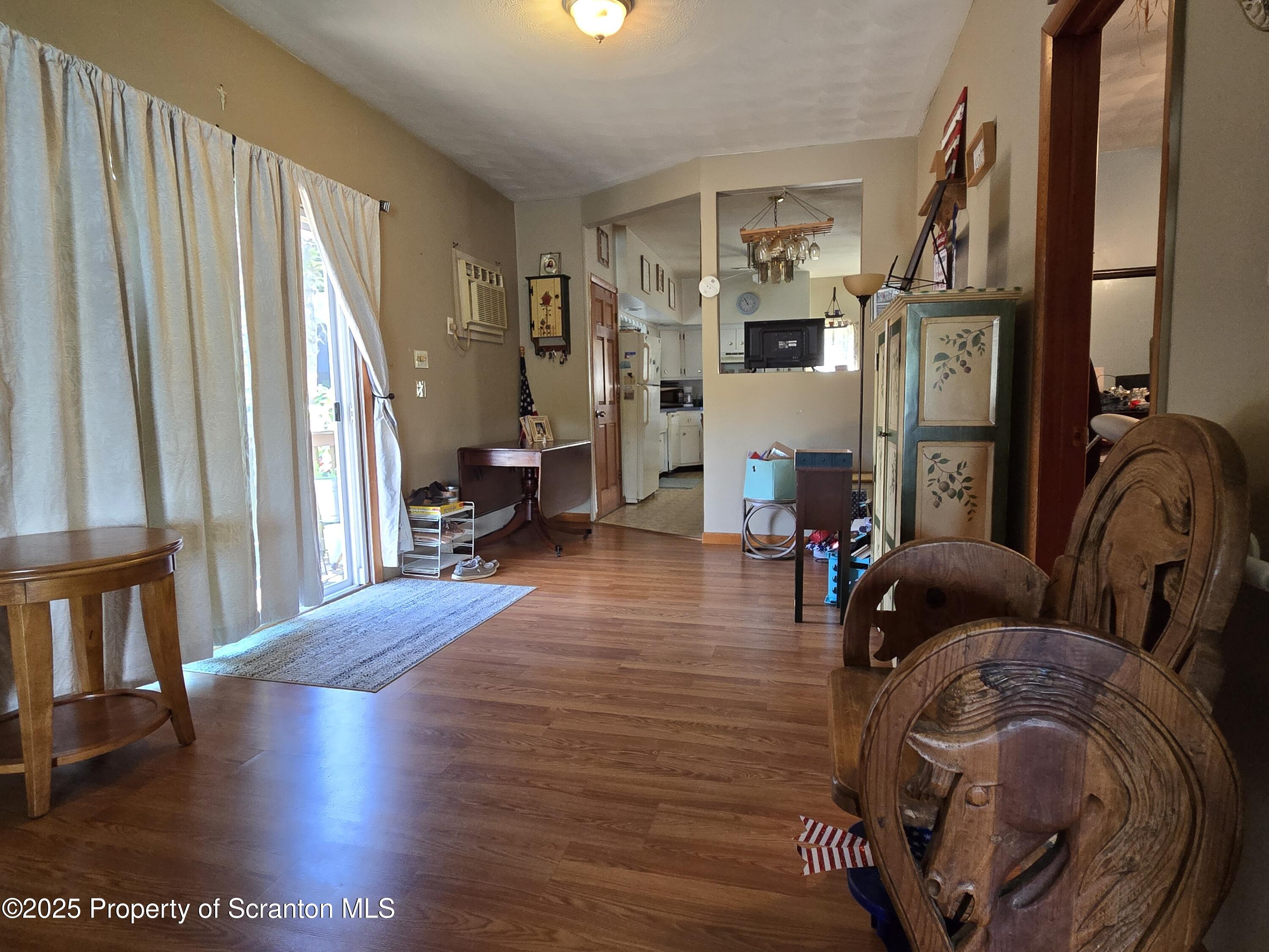 1228 Lake Road Factoryville, PA 18419 - Photo 17 of 31 a living room with furniture and a wooden floor