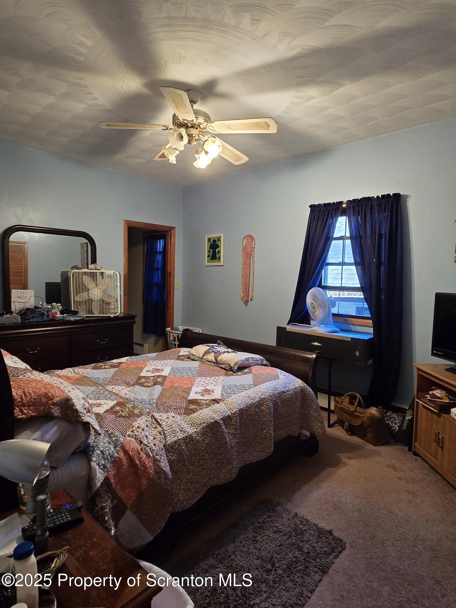 1228 Lake Road Factoryville, PA 18419 - Photo 18 of 31 a bedroom with bed and window