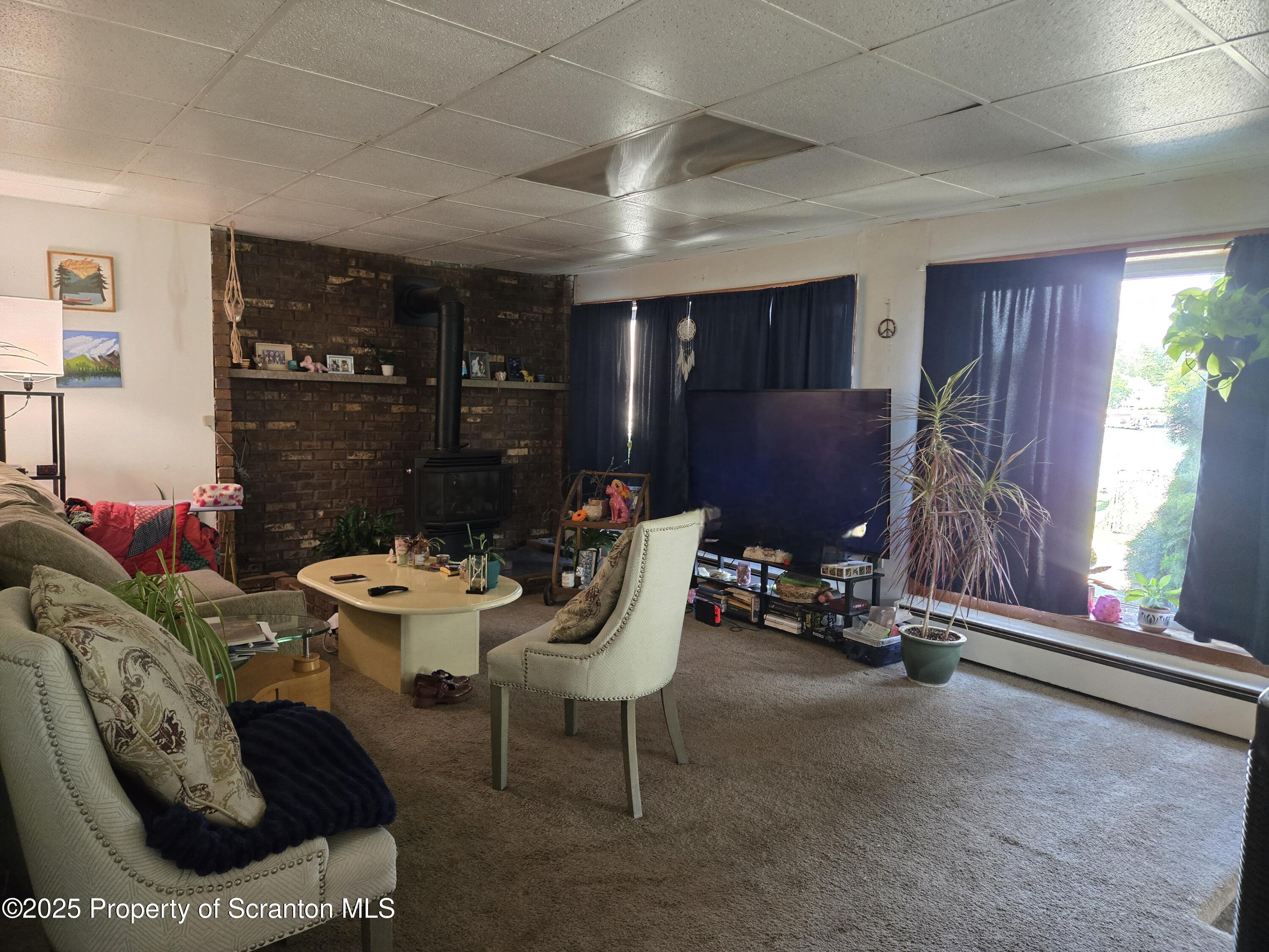 1228 Lake Road Factoryville, PA 18419 - Photo 23 of 31 a living room with furniture and a window