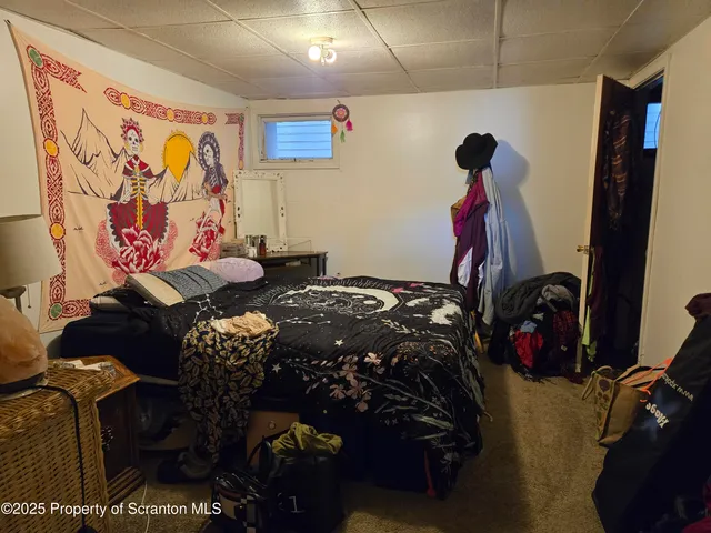 a bed room with a bed and a couch