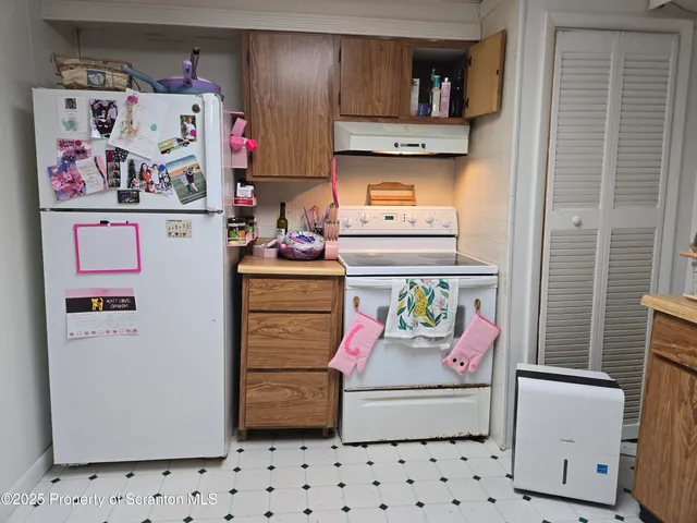 a storage room with washer and dryer