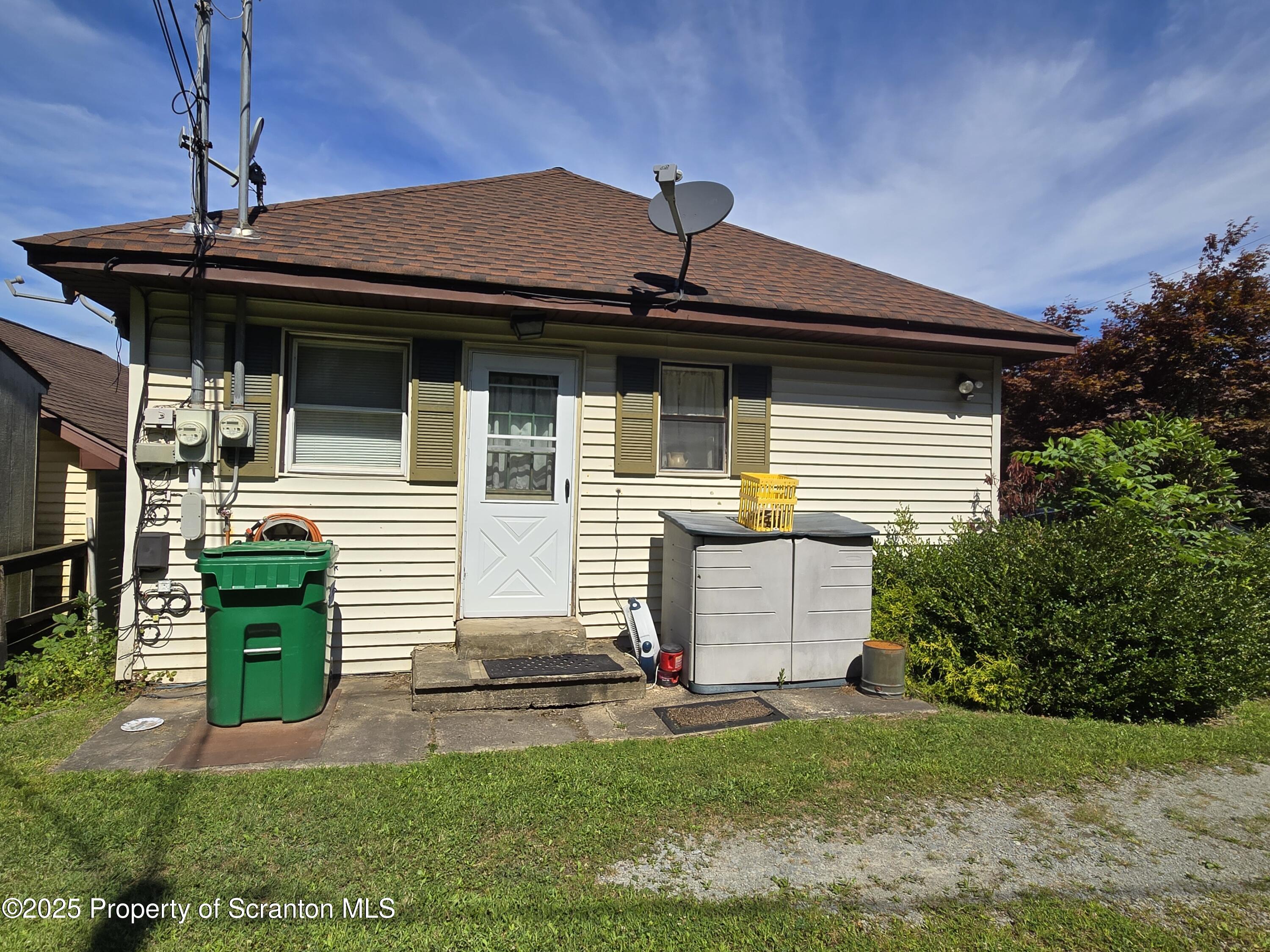 1228 Lake Road Factoryville, PA 18419 - Photo 7 of 31 a front view of a house with a yard
