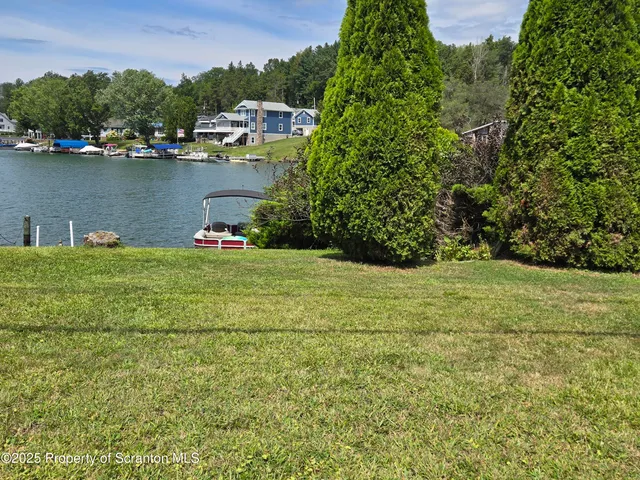 an aerial view of residential house with outdoor space