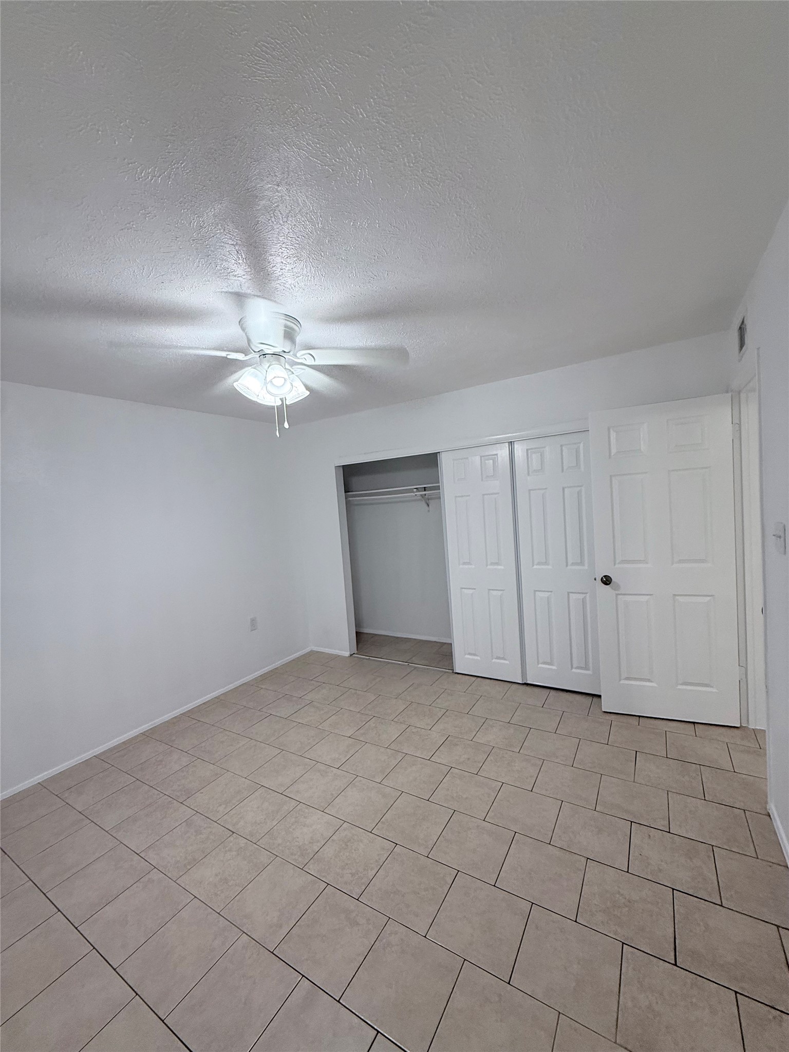 24410 Kennedy Ranch Drive Hockley, TX 77447 - Photo 15 of 20 Spacious primary bedroom with large closet and new ceiling fan.