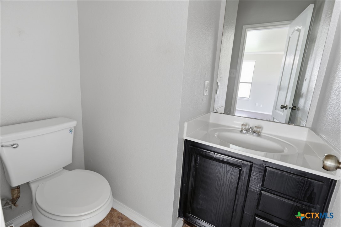 8716 Starview Street Temple, TX 76502 - Photo 27 of 36 Main-level half bathroom perfect for guests, featuring a stylish vanity.