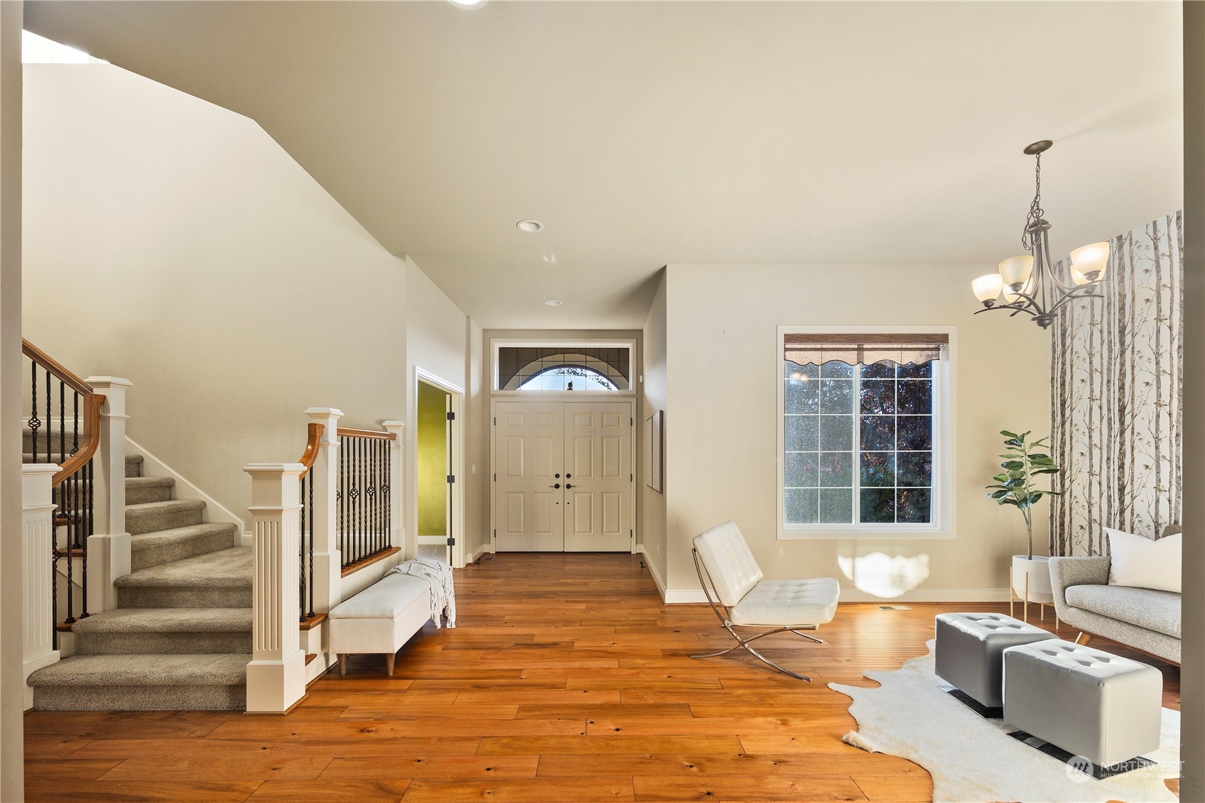 20278 86th Place Northeast Bothell, WA 98011 - Photo 5 of 34 a large bedroom with wooden floor and a large window