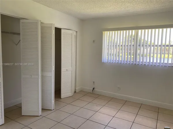 an empty room and window