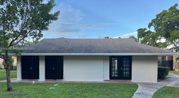 a house view with a garden space