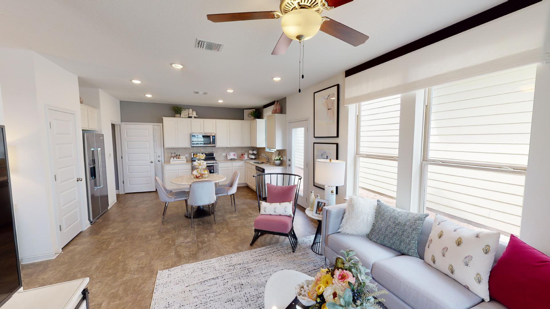 8105 Springsteen Drive Austin, TX 78744 - Photo 6 of 10 Living area featuring a ceiling fan and recessed lighting