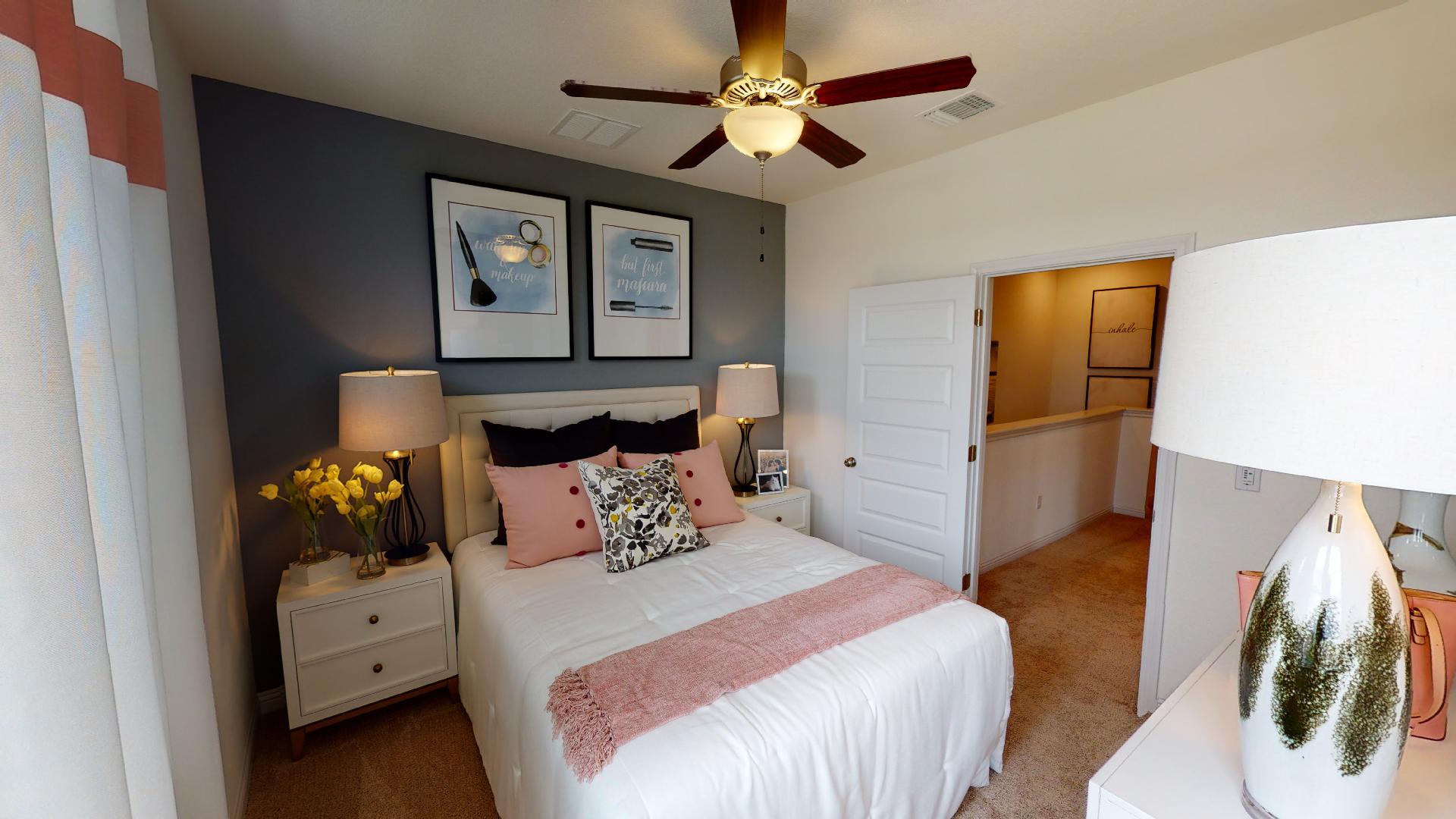 8105 Springsteen Drive Austin, TX 78744 - Photo 9 of 10 Bedroom with carpet flooring and a ceiling fan
