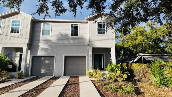 a front view of a house with yard