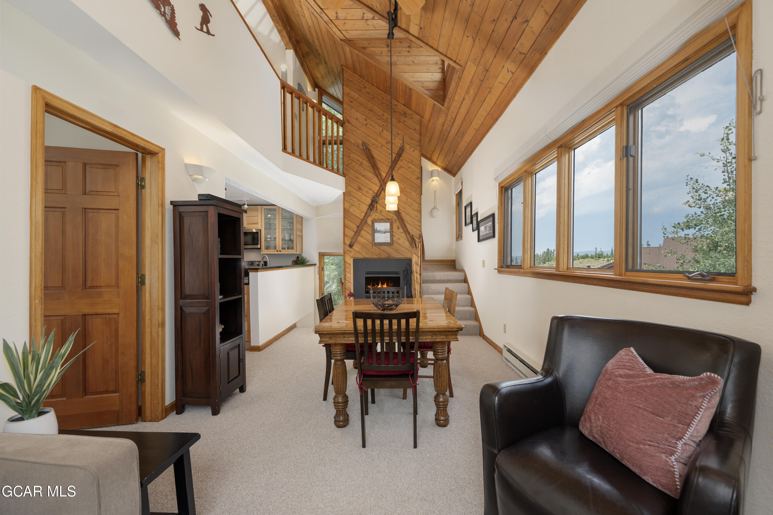 820 Wolverine Lane, Unit 3 Fraser, CO 80442 - Photo 1 of 43 a living room with furniture a fireplace and a large window