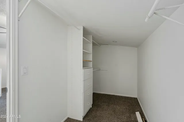 a view of hallway with closet