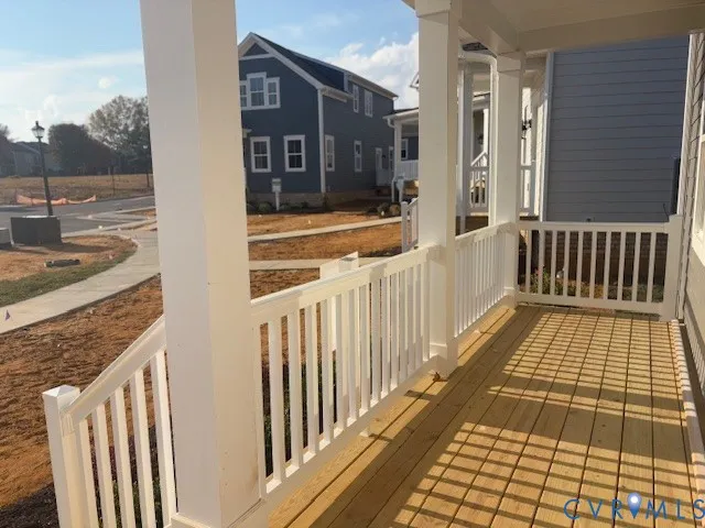 a view of a balcony with wooden floor