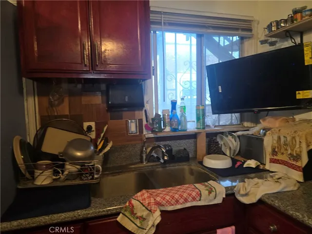 a kitchen with a sink and cabinets