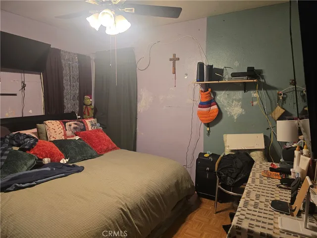 a view of a living room with furniture and a window