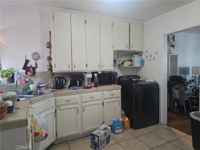 a kitchen with a cabinets and appliances