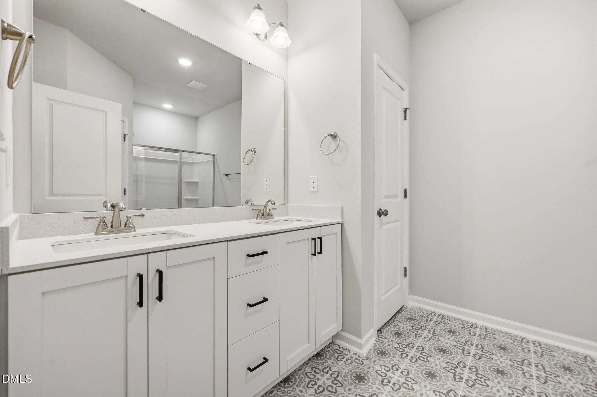 191 Nectar Lane Bunnlevel, NC 28323 - Photo 25 of 35 a bathroom with double sink and a mirror