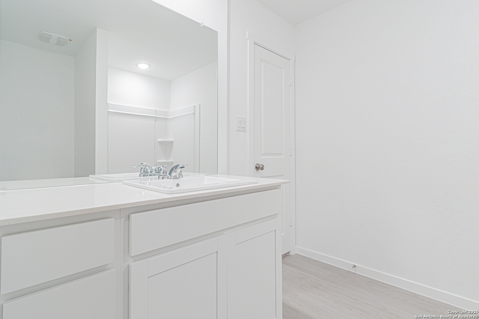 308 Kayden Court Marion, TX 78124 - Photo 14 of 23 a bathroom with a sink and a mirror