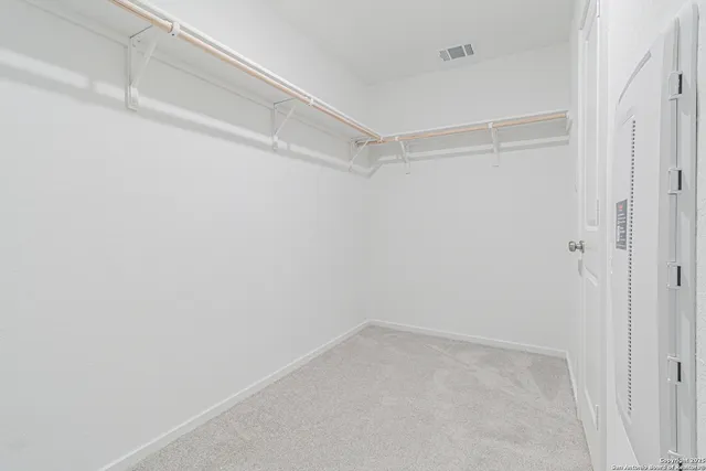 a view of an empty walk in closet