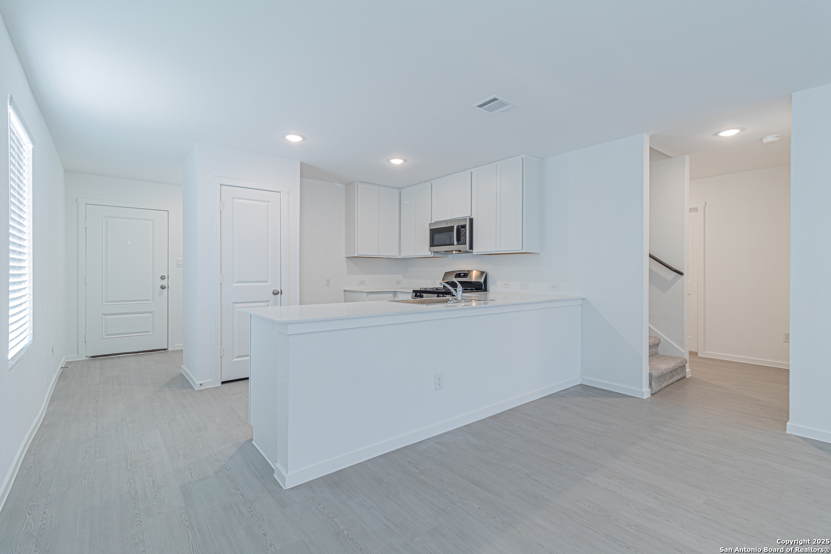 308 Kayden Court Marion, TX 78124 - Photo 5 of 23 a view of a kitchen with white cabinets